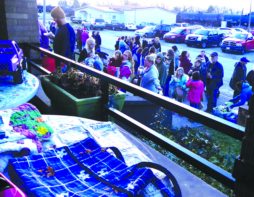 A long line of people formed to see Santa last Wednesday night at the Gathering Wing. The organization received anonymous donations of toys, allowing for gifts for 146 children and two senior citizens who wanted to join in on the fun.
