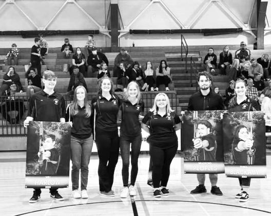 Prior to the start of the Wildcats varsity basketball game versus Augusta on February 7, the seven senior members of the Archery team were recognized. From L-R: Will Harlow, Lilly Brinkdoepke, Kennadi Mayer, Lilly Stephenson, Jeanna Craig, Bradford Peoples and Elissa Blackaby. Photo by Sam McClanahan.