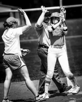 Ladycats sophomore Madison Verst is greeted by head coach Jessica Verst following her game-winning hit against Ryle on April 15. Photo provided by Pete Wigginton.