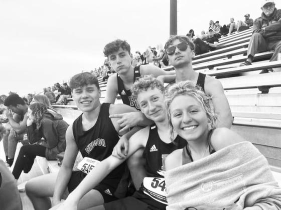 Members of the track team enjoy a break between events during the Ryle Invitational on May 19. Photo courtesy of Sam Dennison