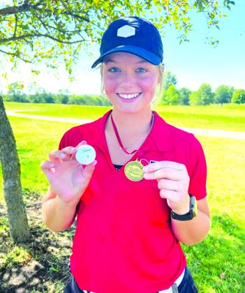 Senior Reese Barlow shows off her individual medal for winning the 8th Region Tournament. Barlow, along with her team, has been one of the top golfers PHS has seen, earning top honors more often than not in competitions throughout the season. Photo courtesy of Kim Barlow.