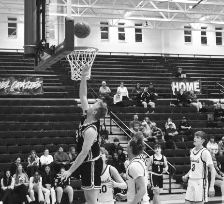 Wildcats senior Austin Kirsch goes up for two of his 10 points in the road win at Bourbon County on January 11. Photo taken by Sam McClanahan.