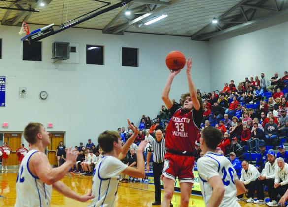 Wildcats junior Aden Merrill rises above the Nicholas County defense for the jumper during their district semifinal game. Photo by Sam McClanahan.