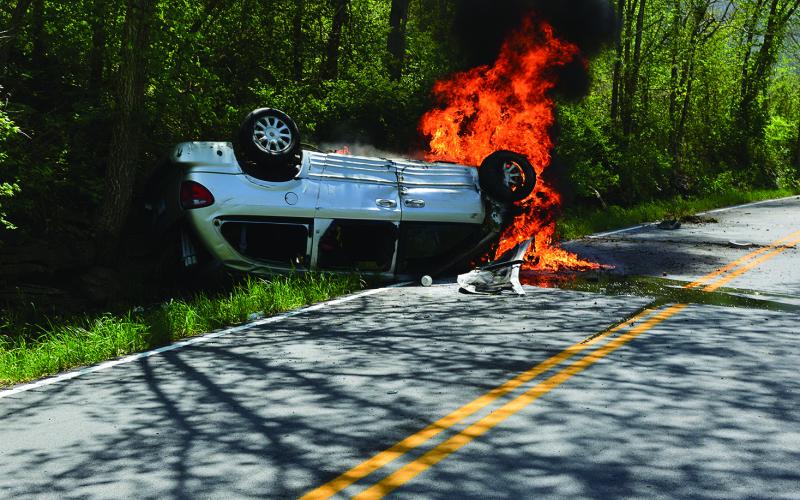 Flames began to consume the white minivan