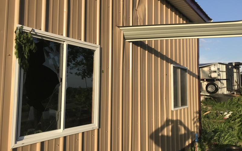 A piece of metal siding became a projectile blown by the strong winds and buried 2 feet deep in Marvin Dawson’s building that had its roof blown off in the last storm.