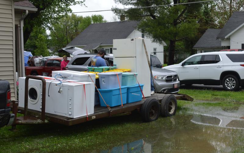 Many homes were filling uip trailers, trucks and animal haulers.