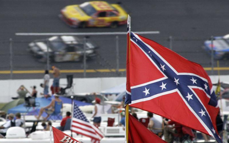 NASCAR moves to prohibit confederate flags at all events and will no longer require personnel to stand during National Anthem. Photo by Associated Press