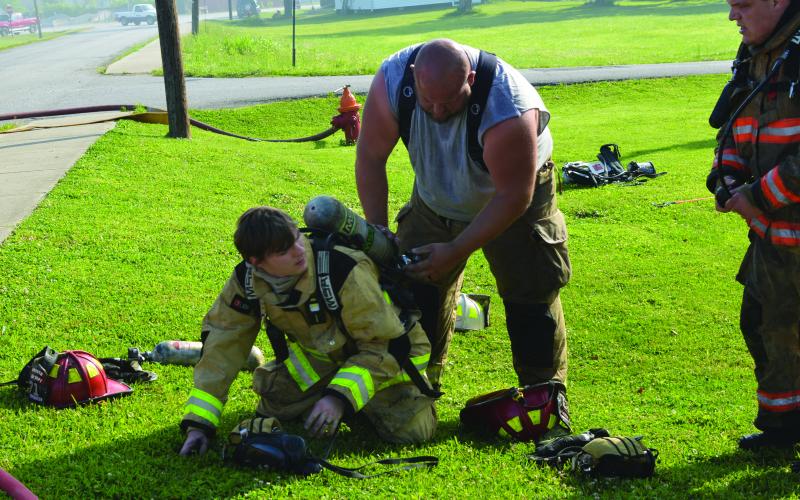 Equipment is checked before heading into the home to battle the flames