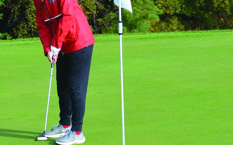 Cailyn Harper with the putt for par on her opening hole.