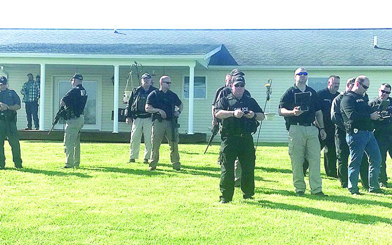 Police awaited directions during the hunt for Justin Mann. Keith Smith