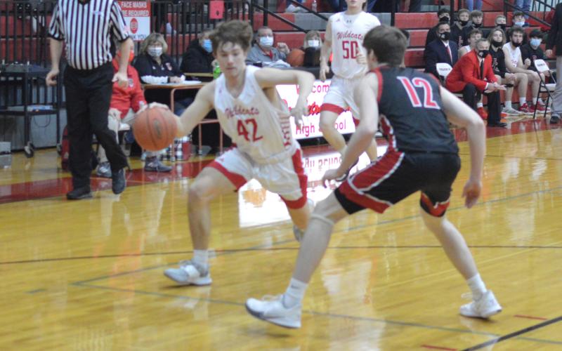 Jacob Redden drives baseline versus the Black Devils. Photo by Sam McClanahan