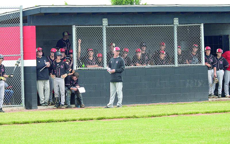The Wildcats loaded the dugout watching the action on the field