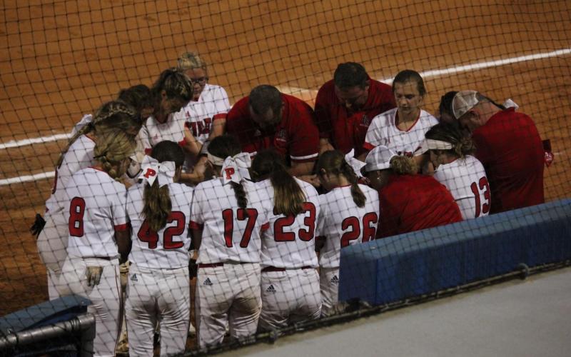 Ladycats say a team prayer before their semi-state game versus Boone County