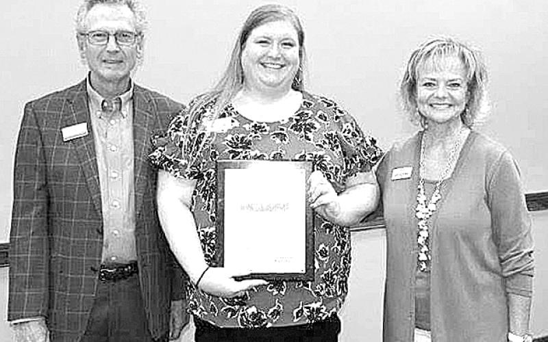 Melanie Hartzel, PC resident and the director of the Pendleton County Tourism Council, received her Elavate graduation certificate Thursday, June 24. Hartzel, center, is pictured with the chair of the board of Leadership Kentucky Dan Bork and Janice Way, an Elevate leader. She says she now has contacts across the state thanks to the Leadership Kentucky initiative.
