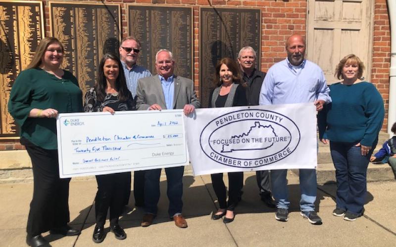 Kim Volgelgesang of Duke Energy Foundation presents a ceremonial check to the PC Chamber of Commerce with Melanie Hartzel of the PC Tourism Council and Judge/Executive David Fields. The money will be available to businesses who need help with past expenses as well as those who have future need. Applications will be reviewed starting mid-May.