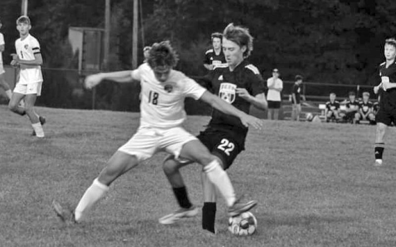 Jonathan Roenker makes a play on the ball challenging the Grant County attacker. Photo by Kacia Shipley