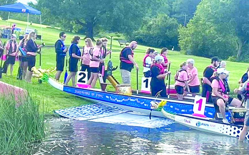 Boarding a dragon boat can be tricky and is easier from the shore, in some ways.