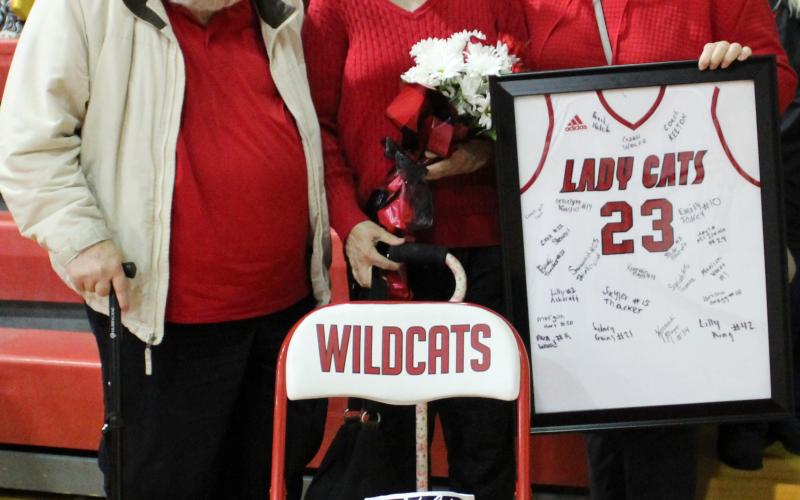 The family of the late Scott Collins was recognized by the Ladycats before the start of their December 7 home game against Dayton. Photo by Stacey Myers