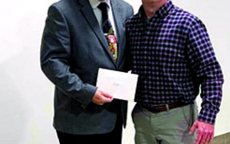 Pictured below with Brother Abram Crozier is Darling’s General Manager, Brad Eden, presenting Crozier with a check for $1,000.00 to be used by Outreach.