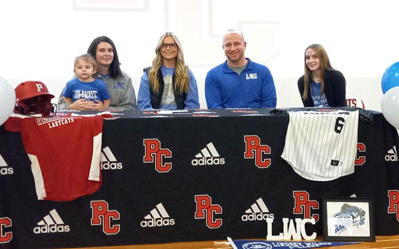 Kayley Bruener was joined by a slew of family, friends, and supporters of the PC Ladycats Fast-pitch Softball Program as she officially signed with Lindsey Wilson Tuesday, January 10. Bruener signed surrounded by her mother Maria, with Brylee on her lap, dad Adam, and sister Taylor. Photo by Sam McClanahan.