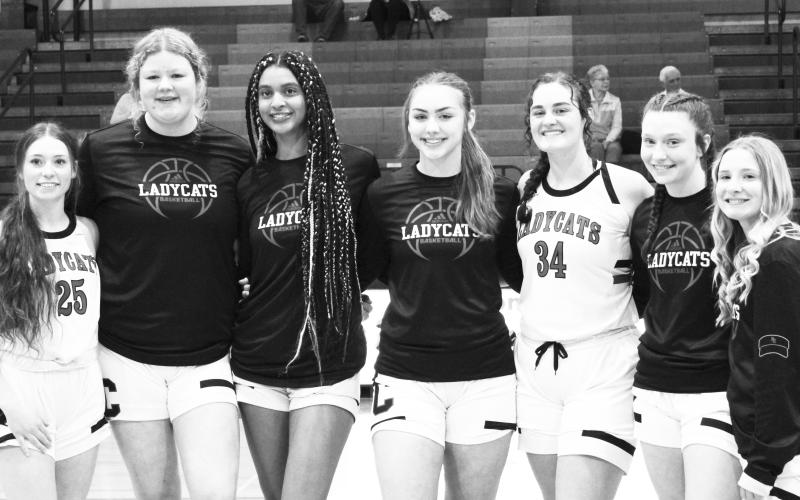 The Pendleton County Ladycats honored their seven Seniors prior to their home victory over St. Patrick on January 21. From left to right: Savannah Shimkowiak, Morgan Hart, Saniah Thomas, Cara Stewart, Kennadi Mayer, Skylar Ashcraft, and Emmie Dunn. Photo by Stacey Myers