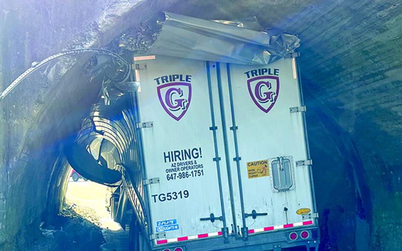 A truck driven from Canada was lodged in the tunnel that leads from Butler to the Demossville area last Tuesday. The truck was cleared from the tunnel, allowing schools to be dismissed on time. Photo by Mayor Mason Taylor.