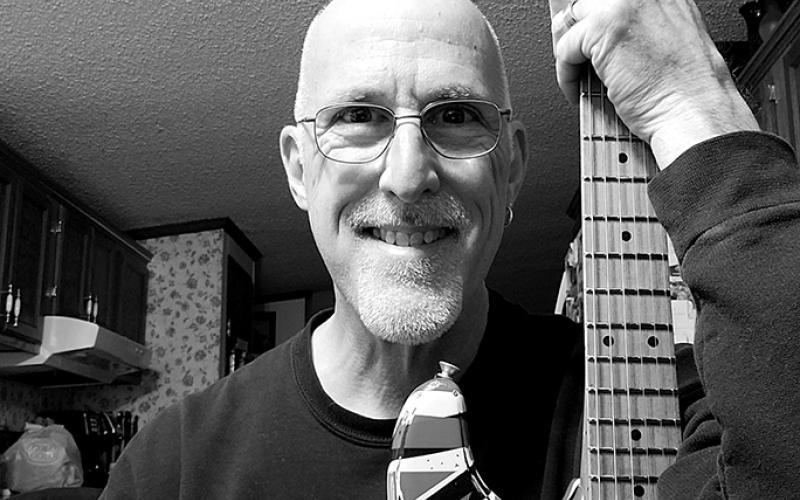 Tom Weber, guitar tech for Eddie Van Halen, shown with one of the guitars often used by Van Halen.