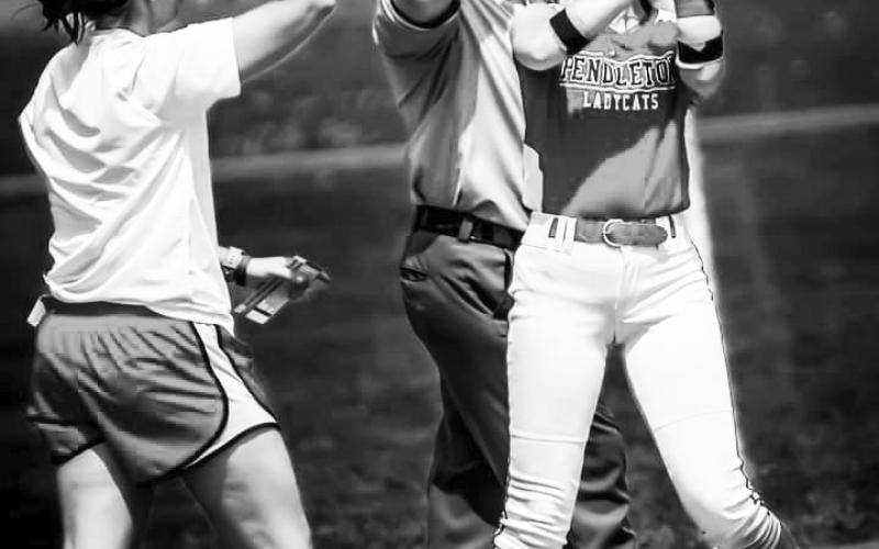 Ladycats sophomore Madison Verst is greeted by head coach Jessica Verst following her game-winning hit against Ryle on April 15. Photo provided by Pete Wigginton.