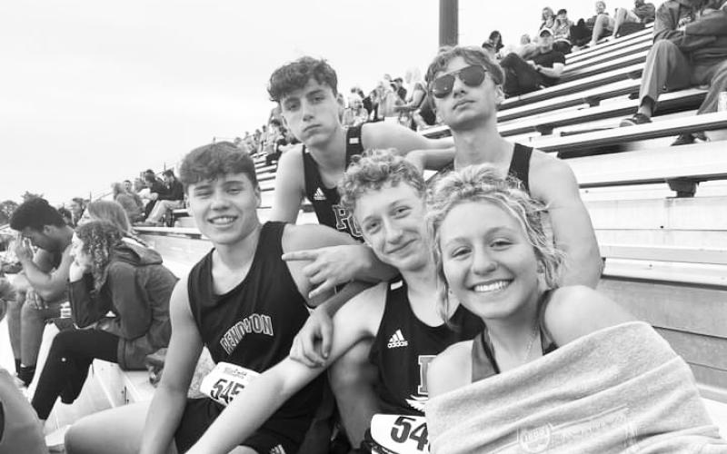 Members of the track team enjoy a break between events during the Ryle Invitational on May 19. Photo courtesy of Sam Dennison