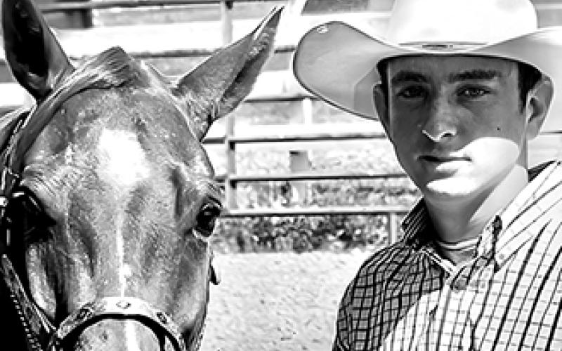 Clay Bowman poses with his beloved horse Charlie.
