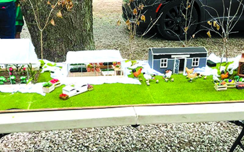 Faith Acres Farm introduced visitors to their establishment with a miniature layout of the farm. The greenhouse, the store, the chicken coop, and other features are visible in the model.