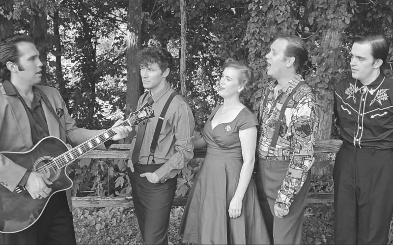 The cast of KRT's MILLION DOLLAR QUARTET shown here L-R: Nathan Roberts (Elvis Presley), Hunter Henrickson (Carl Perkins), Sarah Beth Ganey (Dyanne), Philip King (Jerry Lee Lewis), and Michael English (Johnny Cash) singing outside KRT. Not pictured are Patrick Stanley (Sam Phillips), Garette Koeninger (Fluke) and Zach Gutman (Bro. Jay Perkins).