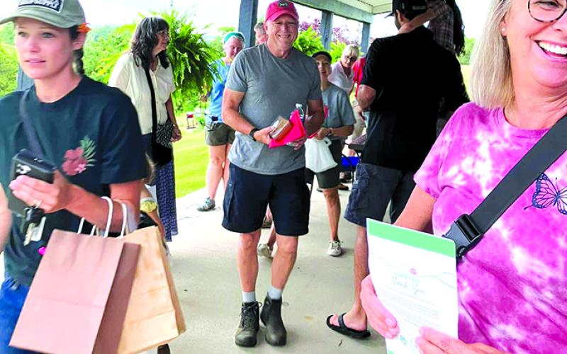 People enjoyed the shelter from the rain as they toured Rose Hill Farm Winery. Jenny Beetz, owner, made sure wine slushies were available along with Martha Lynn’s  treats from Cross Creek Catering.