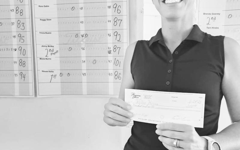 First Flight Champion Kellie House collects her winner's check