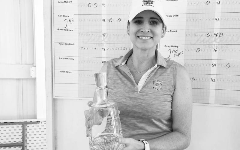 Championship Flight winner Diana Mueller poses with her trophy