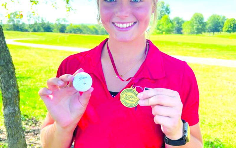 Senior Reese Barlow shows off her individual medal for winning the 8th Region Tournament. Barlow, along with her team, has been one of the top golfers PHS has seen, earning top honors more often than not in competitions throughout the season. Photo courtesy of Kim Barlow.