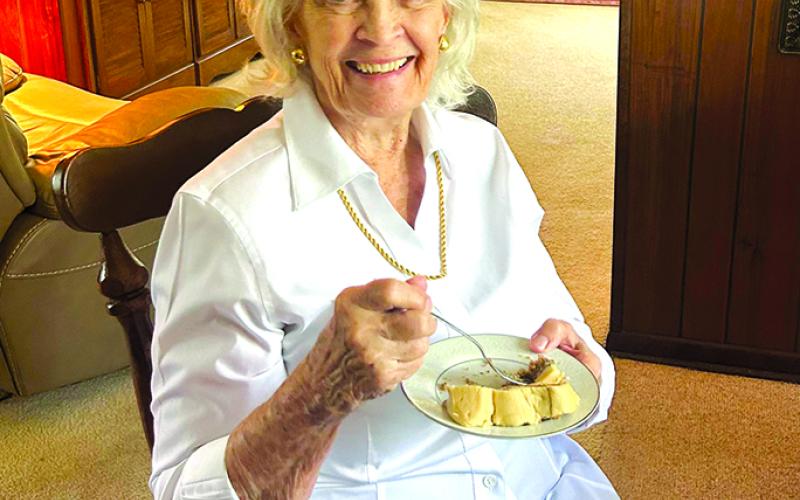 Martha Layne Collins enjoys a blackberry cake from Grammy Tammy's bakery.
