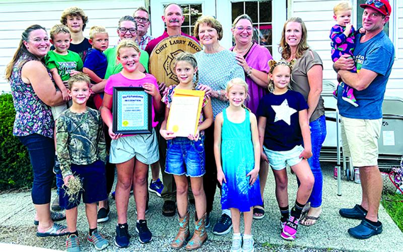 Larry Record, center, is pictured with his family. Record is a third-generation firefighter, having his grandfather and father go before him; in fact, much of his family has been involved in firefighting in some fashion.