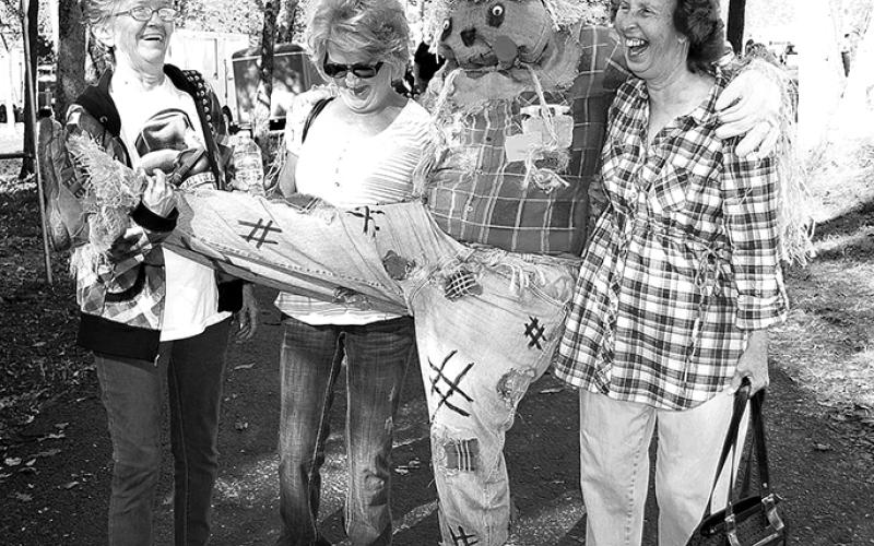 As the Wool Fest grew, so did new ideas for fun. The scarecrow was often a clown, sneaking up behind people to scare them or just finding ways to join in on the fun, as this picture from 2011 demonstrates.