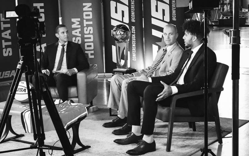 Dontaie Allen, right, along with new Western Kentucky basketball coach, Steve Lutz, center are interviewed by Conference USA about the team's upcoming season.