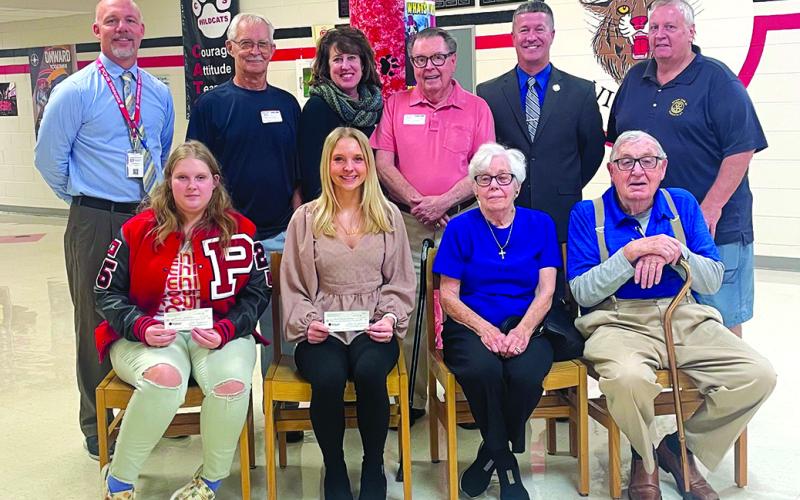 PCHS principal Tony Dietrich, Rotarians Patrick Clore,  Mary Woodhead Hillemeyer, Dan Woodhead, PC Superintendent Joe Buerkley, Rotarian Darryl Ammerman, PCHS Seniors Alliyah Webster and Emily Jodrey, Rotarians Janice and Owen Collins.