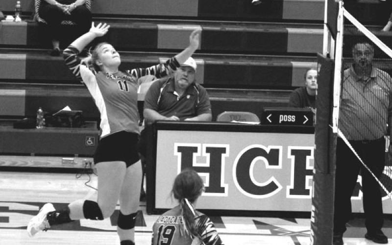 Skyla Harrison attacks the net for a spike against Robertson County. Photo courtesy of Sam McClanahan and Will Jones/10thregion.com