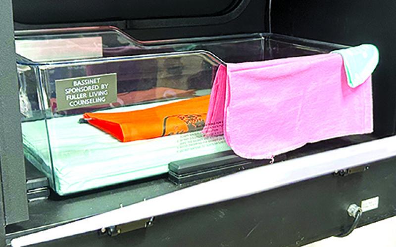 The inside of the Safe Haven Box is similar to a hospital bassinet in looks, but it is equipped with a laser beam that sounds a silent alarm when it is broken, and the bed covers a scale confirming the presence of an infant, as well. The box is climate-controlled.