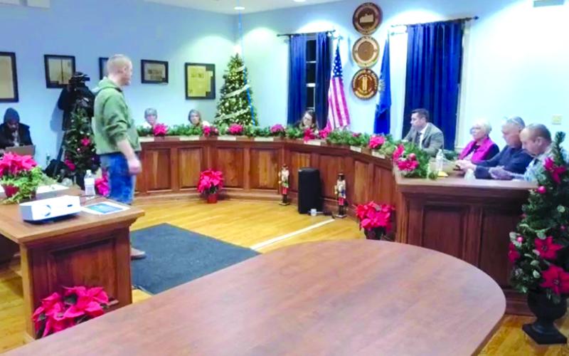 In the past two meetings, the mayor has stood over council rather than sitting with them in the center as is his usual place. This photo was taken as the council was voting to proceed with the budget amendment, hiring a lawyer, and to enter a closed session as is prescribed by law.