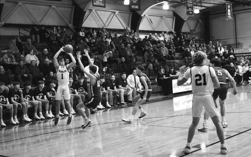 Senior Hunter Jack fires a three pointer from the corner. Photos taken by Sam McClanahan.