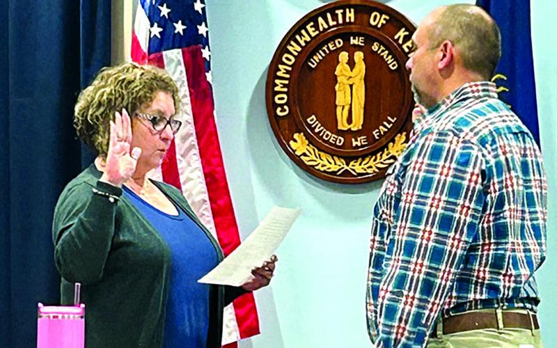 City Clerk Susan Bishop, left, swears in new mayor Luke Price at the beginning of a specially called City Council meeting Jan. 9. Price has been an active member of City Council for five years. He replaces Sebastian Ernst and will be up for special election in November. Photo by Brian Reid.