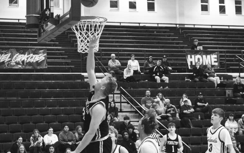 Wildcats senior Austin Kirsch goes up for two of his 10 points in the road win at Bourbon County on January 11. Photo taken by Sam McClanahan.