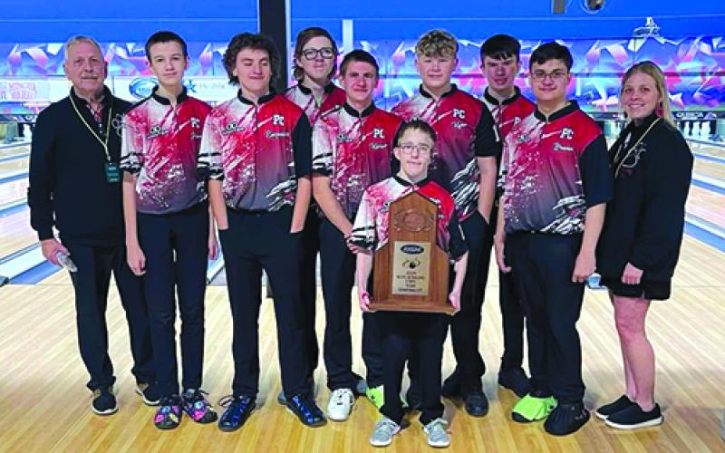 The PCHS boys bowling team are, from left, Ronnie Hutchison, Adam Straus, Chance Enzweiler, Leroy Bryan, Karson Enzweiler, Colton Webster (holding the trophy), Kyan Brewer, Braden Brann, Bradley Brann and Amber Brewer. Photos courtesy of Rhonda Hutchinson.