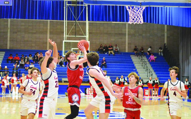 Senior Alex Beyst puts up a jumper during the fourth quarter. All photos by Sam McClanahan.