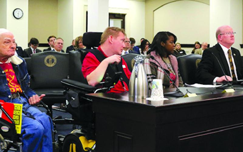 Arthur Campbell Jr. of Louisville, left, and Frank Huffman of DeMossville join state Rep. Mark Hart, R-Falmouth, to testify before the House Standing Committee on State Government about rights for those whose freedoms have been limited because of disabilities. The act that aims to expand the 1986 Bill of Rights for Persons with Developmental Disabilities has been dubbed the Frank Huffman Act.